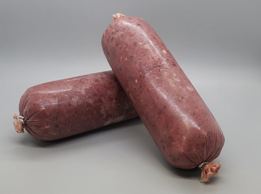 Tube of frozen raw dog food. Blend of beef, pork, and lamb with beef tripe. Edmonton raw dog food.