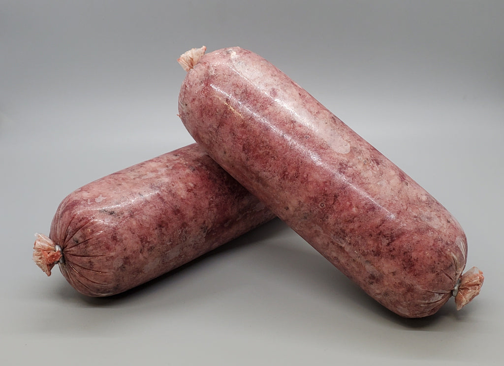 Tube of frozen raw dog food. Ground beef muscle meat with bone and beef organ and beef tripe. Edmonton raw dog food.