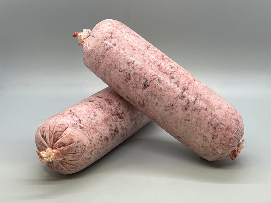 Tube of frozen raw dog food. Ground duck with beef organ, beef muscle meat and beef tripe. Edmonton raw dog food.