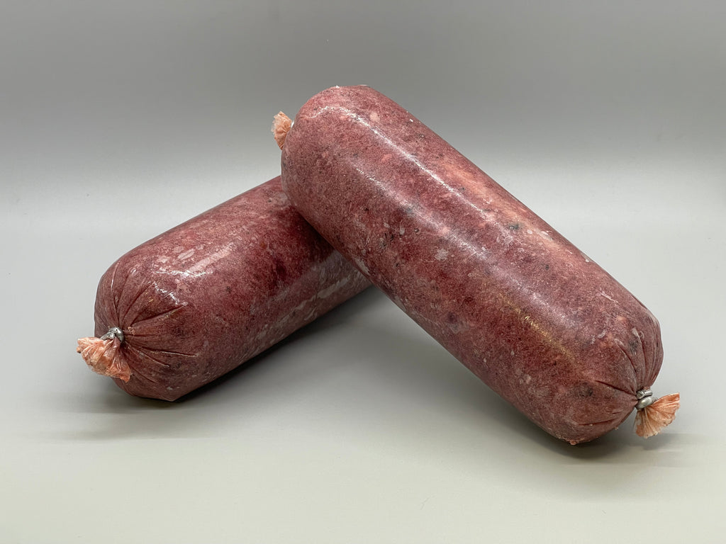 Tube of frozen raw dog food. Ground turkey and beef muscle meat with beef organ and beef tripe. Edmonton raw dog food.